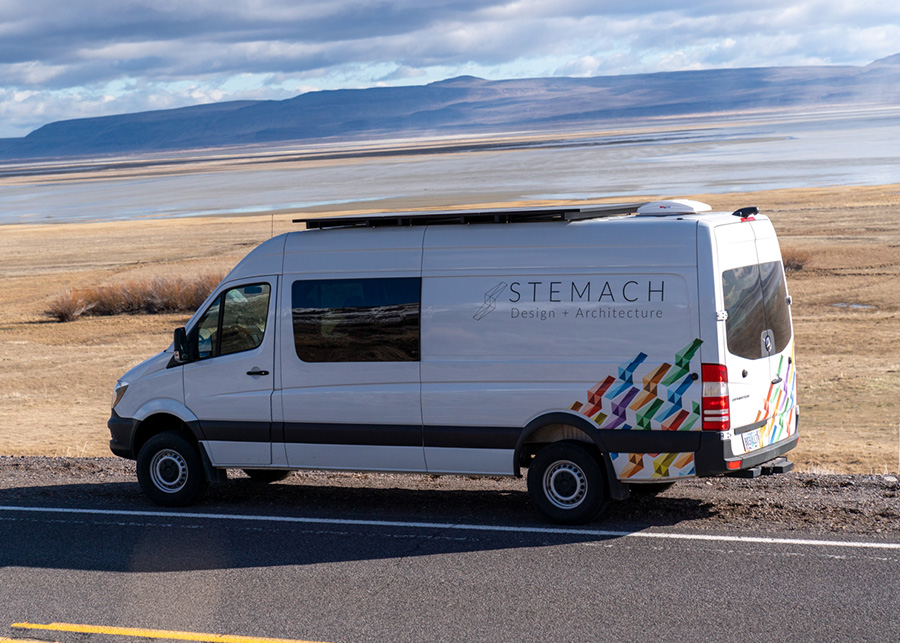 An exterior view of the van with the Stemach Design logo painted along the side